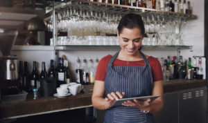 Happy Bartender with Wireless Handheld Bar POS